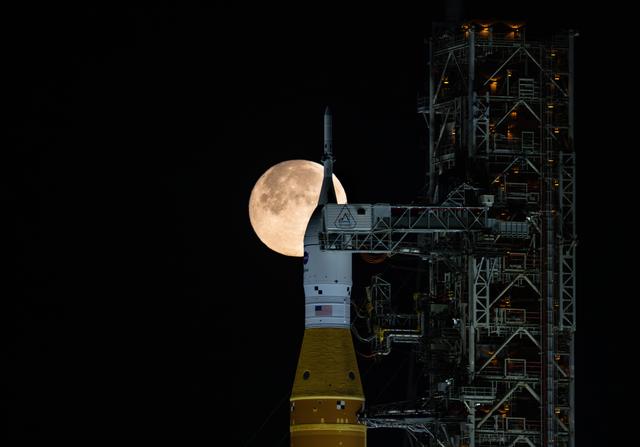 NASA image: Full Moon Rising Over Full Artemis II Stack at Launch Pad 39B